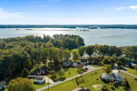 3 bedroom/2 full bath lakefront home with gentle slope to private covered dock