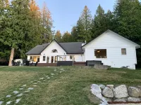 Amazing sunsets!! Water view, hot tub, close to town, fire pit.