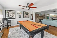 Iconic Front Porch and Timeless Charm - Charming Poolside Oasis