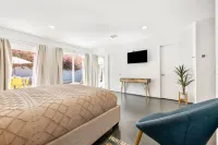 Four bedroom suites, private pool, spa & gourmet kitchen on .25 acre!