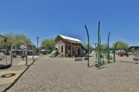 New 4 BR home with garage, pool, play area, splash pads, fenced backyard