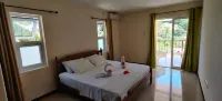 Peace in Paradise with mountain views and  5 minutes walk to the beach