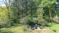 Serene Wooded Escape with Hot Tub and Fire Pit - Charming Haven