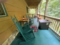 Spacious suite surrounded by nature with living room, fireplace, porch, fire pit