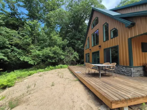Newly built 4-bedroom cottage w/ WiFi & AC next to dunes, Lake Michigan & beach
