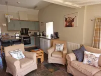 Beautiful cosy 2 bed cottage with woodburner & hot tub overlooking small lake