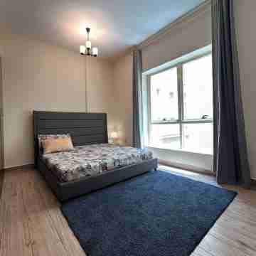 Cozy 2-bedroom apartment in charming Sharjah with AC Rooms