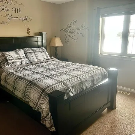 Spacious 4-bedroom townhome in charming Red Deer with WiFi, AC