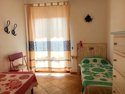 Holiday House La Rosa dei Venti Hotels near Capo d'Orso