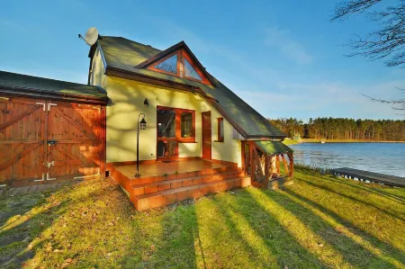 Holiday Home by Lake Rosnowskie with Boat Отели в г. Koszalinski