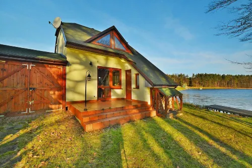Holiday Home by Lake Rosnowskie with Boat Hotels in Koszalinski