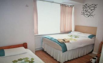 Room in Guest Room - Family Room Sleeps 3 with 1 Double and 1 Single Bed Ground Floor Private Shower