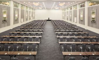 a large conference room with rows of tables and chairs arranged for a meeting or event at Hyatt Regency Grand Reserve Puerto Rico