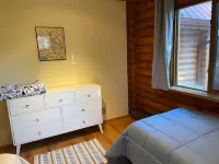 Cheerful Cabin with large stone patio and hot tub, next to trails!!