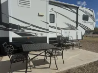 Cozy RV tucked back in a quiet property with plenty of room to relax