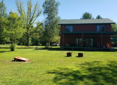 Gorgeous 4Br Log Retreat on 40 Acres —Pond View – Mid-Michigan—sleeps 11+