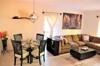 Luxury Condo Close to the beach,Tropical Setting,Garden Patio, Golf Club Nearby