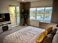 "Luxury Lakefront Paradise: Heated Pool Haven with Unrivaled Views"