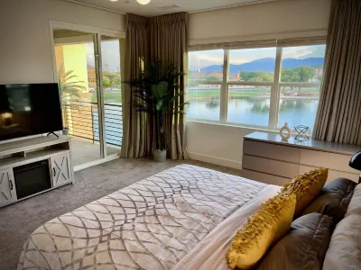 "Luxury Lakefront Paradise: Heated Pool Haven with Unrivaled Views"