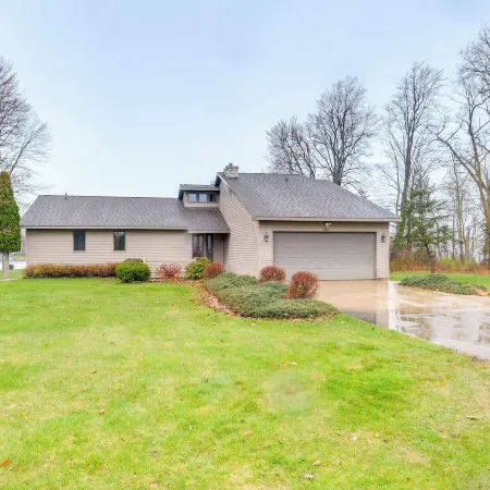 Cadillac Vacation Rental w/ Dock on Lake Mitchell!