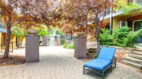 Walk-Out Patio and Access to Lush Alpine Courtyard - Cozy Modern Haven