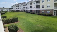 2 BR condo-pool, remote work, golf courses, and family attractions nearby