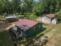 Charming Green Cabin with Private Round Lake Access, Minutes from Ludington