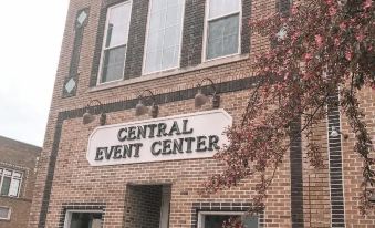 "a brick building with a sign that reads "" central event center "" prominently displayed on the front of the building" at Inn on Central
