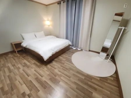 Yangyang Happyville Pension Отели рядом с достопримечательностью «Наксан- Бич»