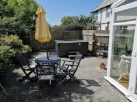 Honeysuckle Cottage with optional hot tub and shared EV charger.