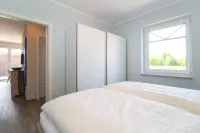 Modern first floor apartment with sauna and beach chair in the garden for 4 persons Hotels in Norden