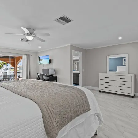 Water Front Home with Heated Pool & Hot Tub, 2 Master Suites & a Floating Dock.