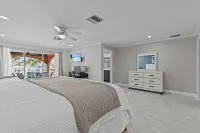 Water Front Home with Heated Pool & Hot Tub, 2 Master Suites & a Floating Dock.