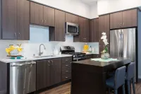 Resort-Style Pool and Rooftop Deck with Skyline Views - Elegant Oasis Hotels in Campbell