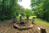 Moonshine Cabin with a nice yard on the creek in the shadows of the Smokies