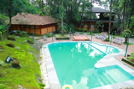 Blue Ginger Resorts Отели рядом с достопримечательностью «Kakkadampoyil.hills view vythiri»