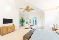 Waterfront Pink House with Private Dock & Pool