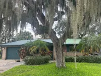 Cozy 2-bedroom house on the canal in charming Port Richey with AC, & WiFi. Hotels near Ridge Road Shopping Center