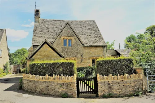 A Quaint Grade 11 Listed Detached Stone Cottage In Lower Slaughter with parking.