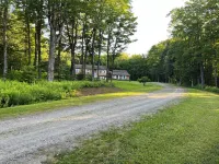 Spacious five-bedroom home off Back Lake with direct trail access on Spooner Rd