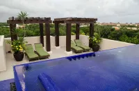 Charming 2-bedroom condo with WiFi, AC in wonderful Puerto Aventuras