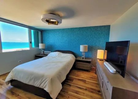 The BEACH PAD- A Beachfront,  Full Ocean View Apartment