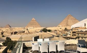 Cleopatra Pyramids View