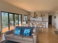 Stunning water views; relaxed coastal atmosphere; multiple entertaining areas