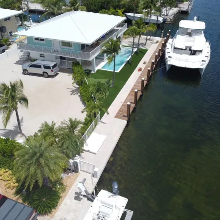 Coconut Sunsets Open Water Views, Ice, Pool, Spa 100 ft dockage, Putting Green
