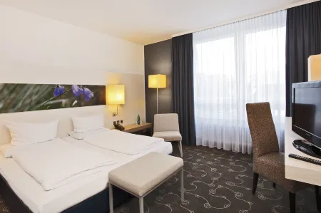 Concorde Hotel Siegen Отели в г. Нетфен