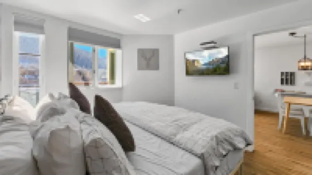 Chic Condo with Stunning Lake and Mountain Views - Inviting Escape