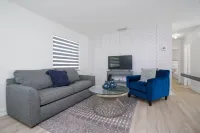 Sleek Kitchen and Cozy Living Area - Inviting Modern Haven Hotels in South Miami Heights