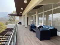 A 4 BHK VILLA WITH A PRIVATE INFINITY POOL SURROUDED BY SERENE HILLS