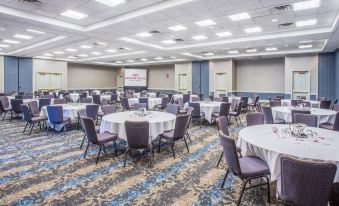 a large conference room with multiple round tables and chairs , all set up for a meeting or event at Doubletree by Hilton Columbus Dublin